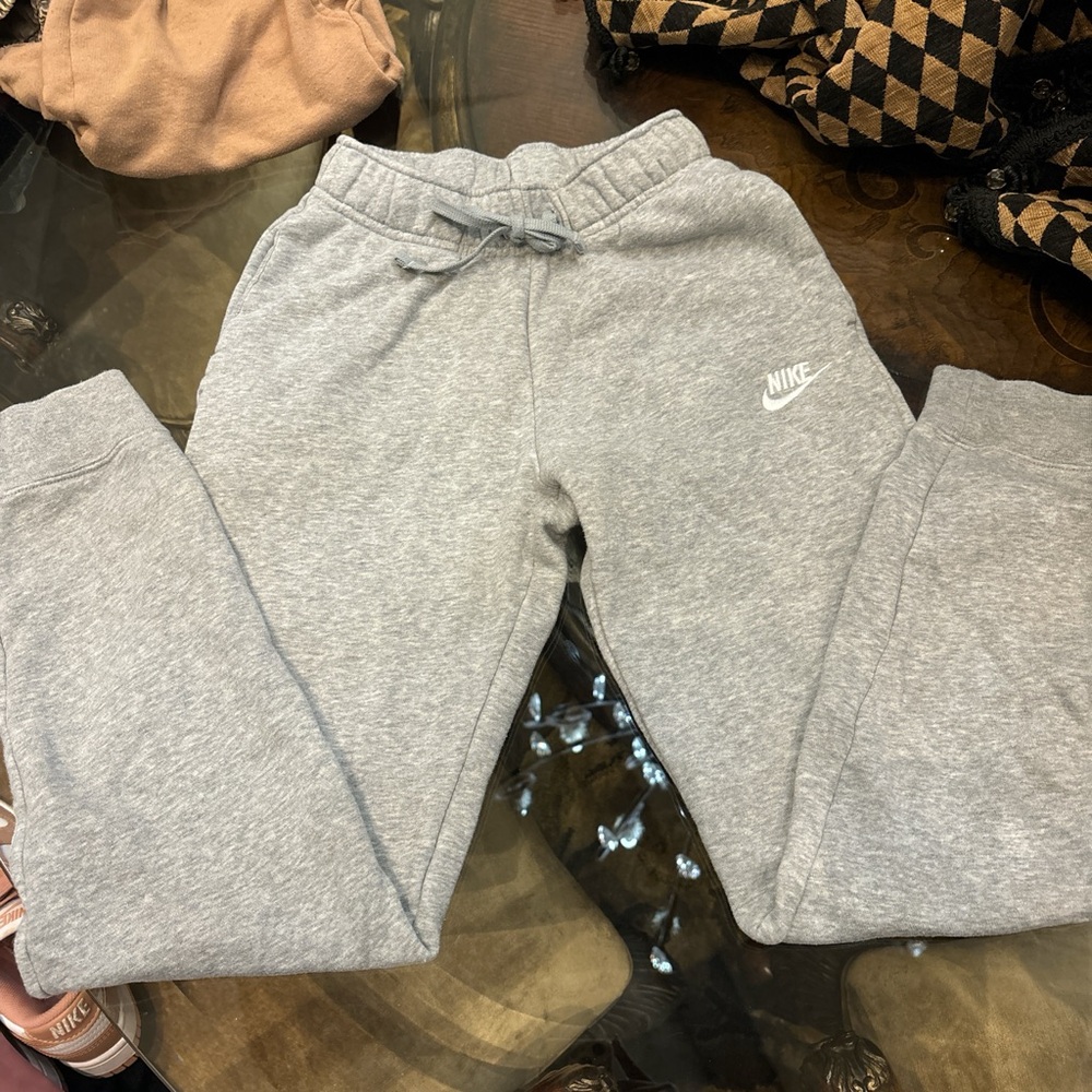 Woman’s grey Nike sweats